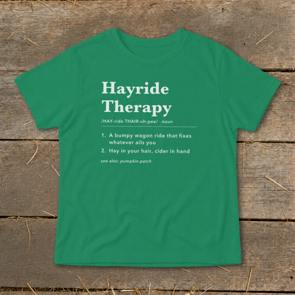 Green t-shirt with "Hayride Therapy" definition and related terms.