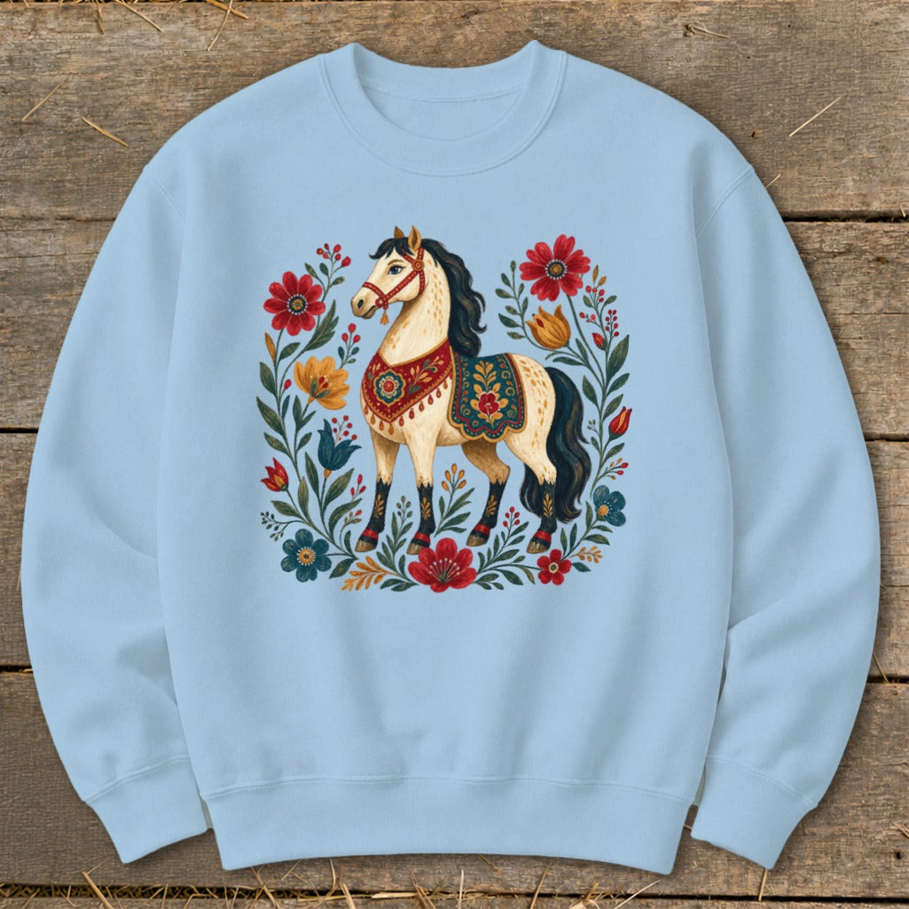 Light blue crewneck sweatshirt with a decorative horse and floral wreath design.