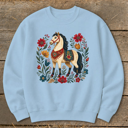 Light blue crewneck sweatshirt with a decorative horse and floral wreath design.