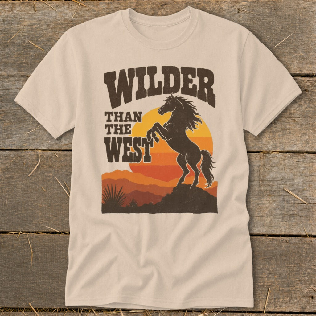 T-shirt with "Wilder Than The West" text, a rearing horse, and desert sunset graphic.