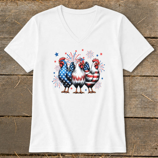 Three roosters in patriotic red, white, and blue designs with fireworks.