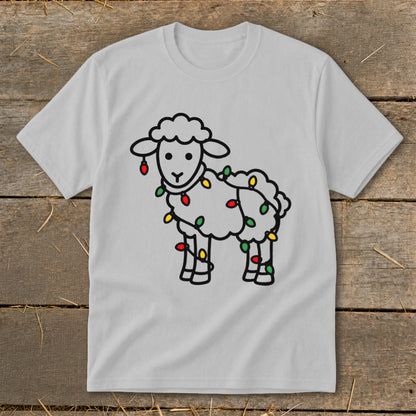 Light gray crew neck t-shirt featuring a black line drawing of a sheep tangled in colorful Christmas lights.