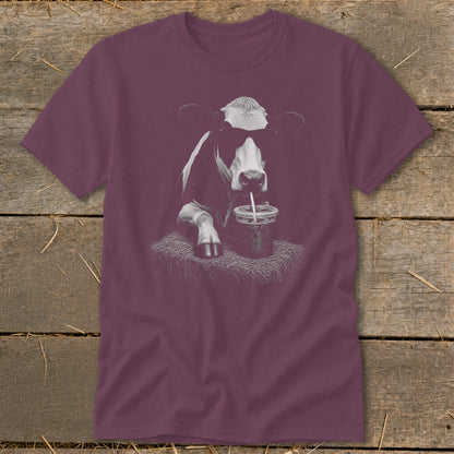 T-shirt with a graphic of a cow wearing sunglasses drinking from a cup.