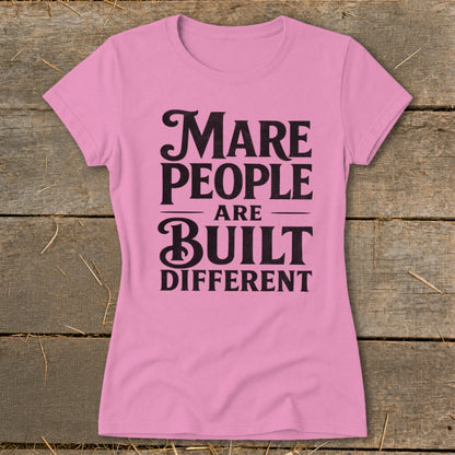 Pink t-shirt with "Mare People Are Built Different" text in black.