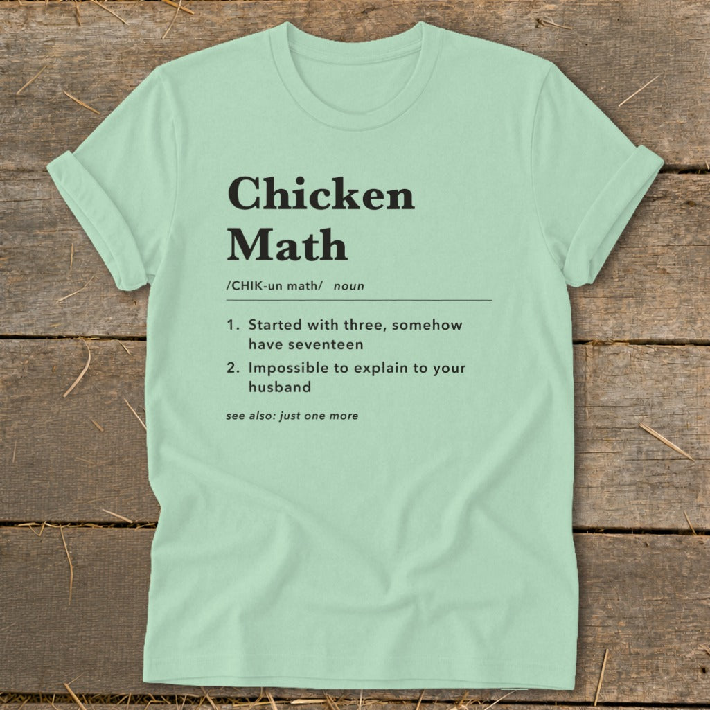 Light mint t-shirt with "Chicken Math" definition including numbered points and "see also" note.
