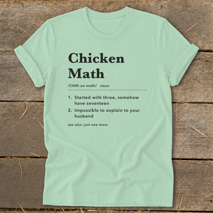 Light mint t-shirt with "Chicken Math" definition including numbered points and "see also" note.