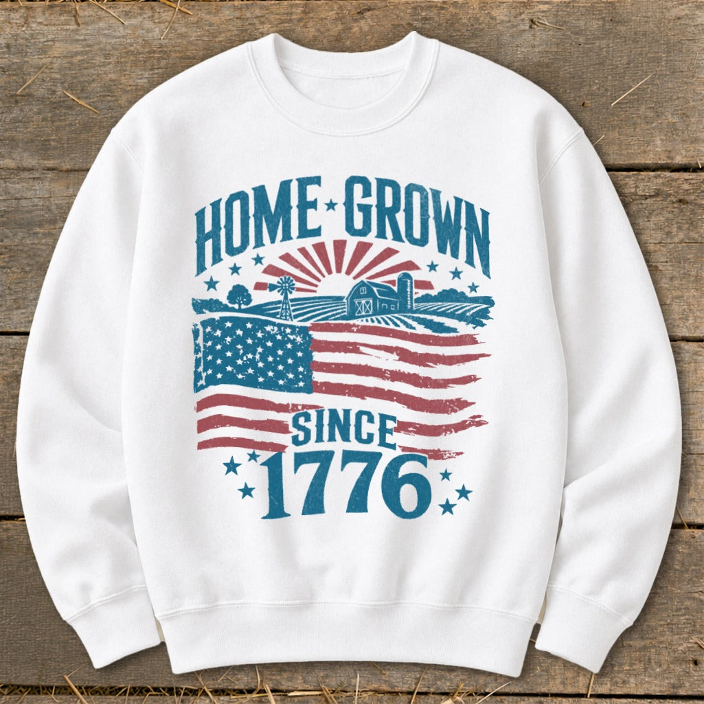 White sweatshirt with "Home Grown Since 1776" text and American flag farm graphic.