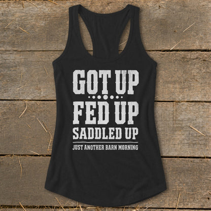 Black tank top with distressed white text "Got Up Fed Up Saddled Up Just Another Barn Morning."