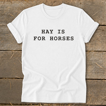 White t-shirt with "HAY IS FOR HORSES" printed in black text.