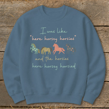 Blue sweatshirt with "I was like 'here horsey horsies' and the horsies here horsey horsied" text and horse graphics.