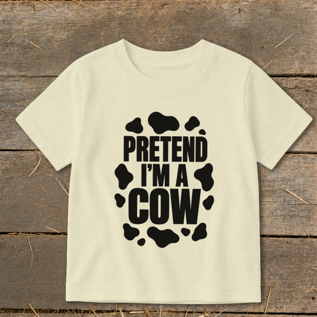 Cream t-shirt with black "Pretend I'm a Cow" text and spots.