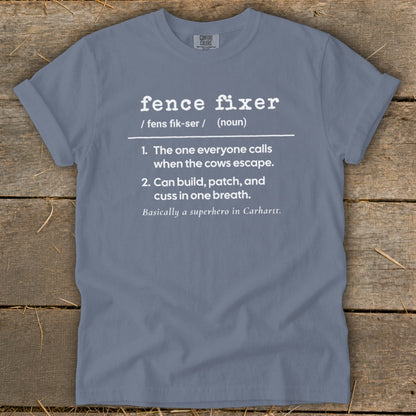 Gray t-shirt with "fence fixer" definition including humor about cows escaping.