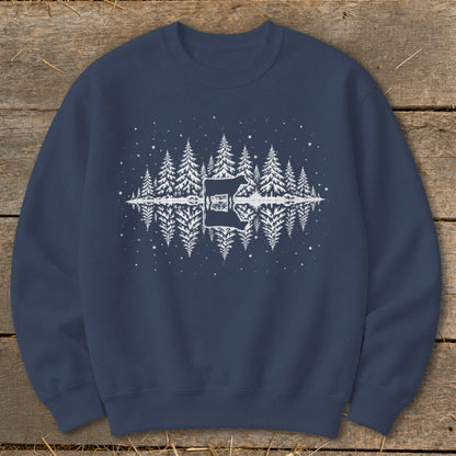 Dark blue sweatshirt with white graphic of cow and pine trees reflected in water.