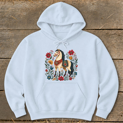 Light blue hoodie with a folk art horse and floral design centered on the chest.