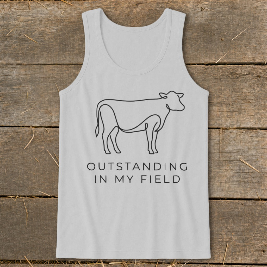 Gray tank top with a line drawing of a cow and text that reads "OUTSTANDING IN MY FIELD".