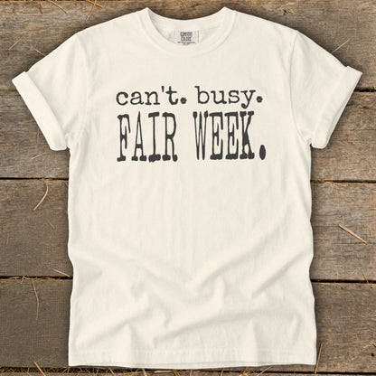 Cream Comfort Colors t-shirt with black text "can't. busy. FAIR WEEK."