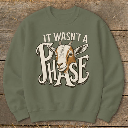 Green sweatshirt with goat graphic and text "IT WASN'T A PHASE".