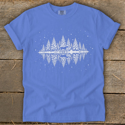 Blue t-shirt with white graphic of horse and pine trees reflected in water.