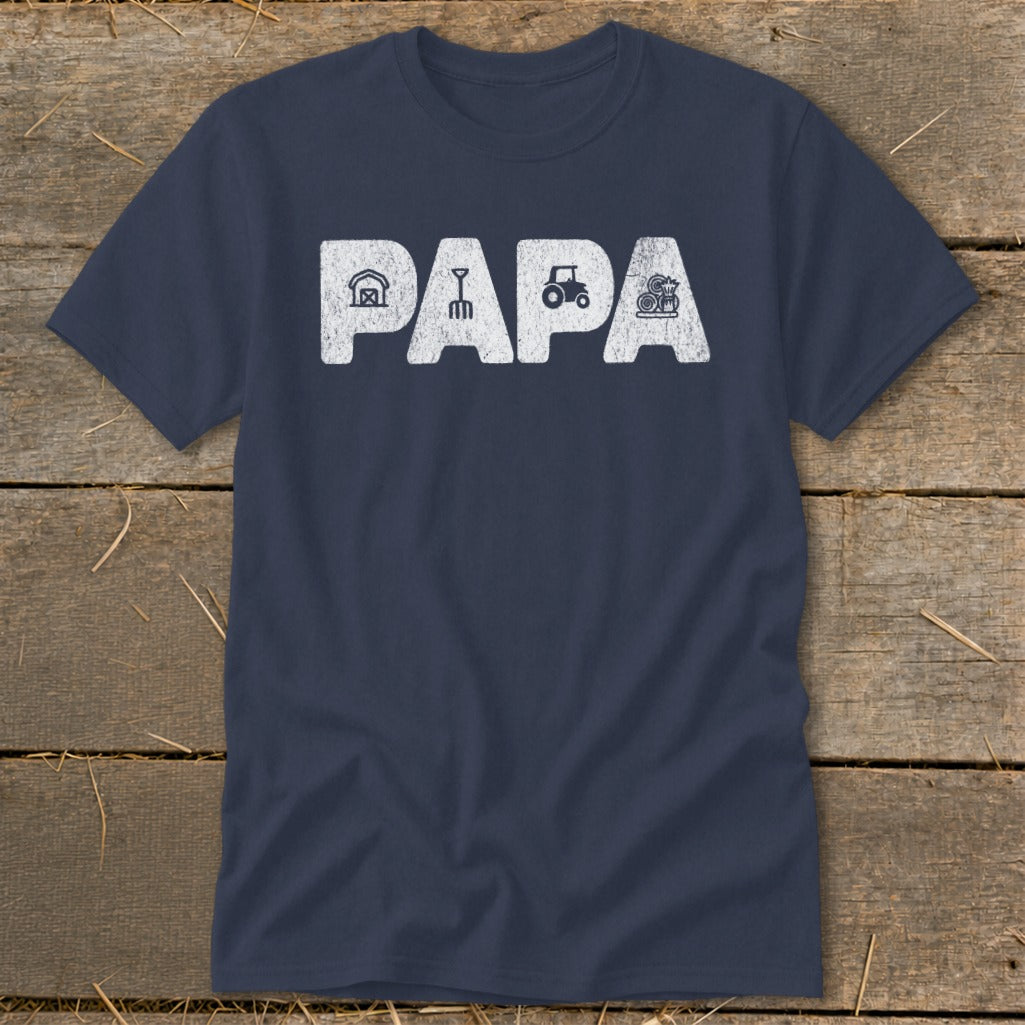 Navy t-shirt with "PAPA" text featuring farm icons: barn, pitchfork, tractor, and hay bale.