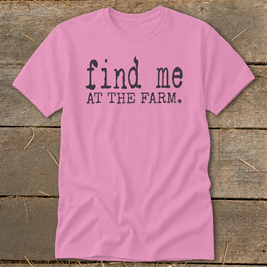 Pink t-shirt with black text "find me AT THE FARM."