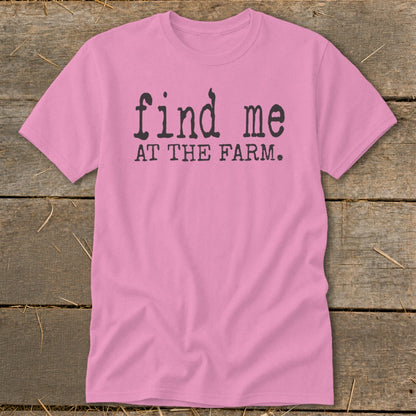 Pink t-shirt with black text "find me AT THE FARM."