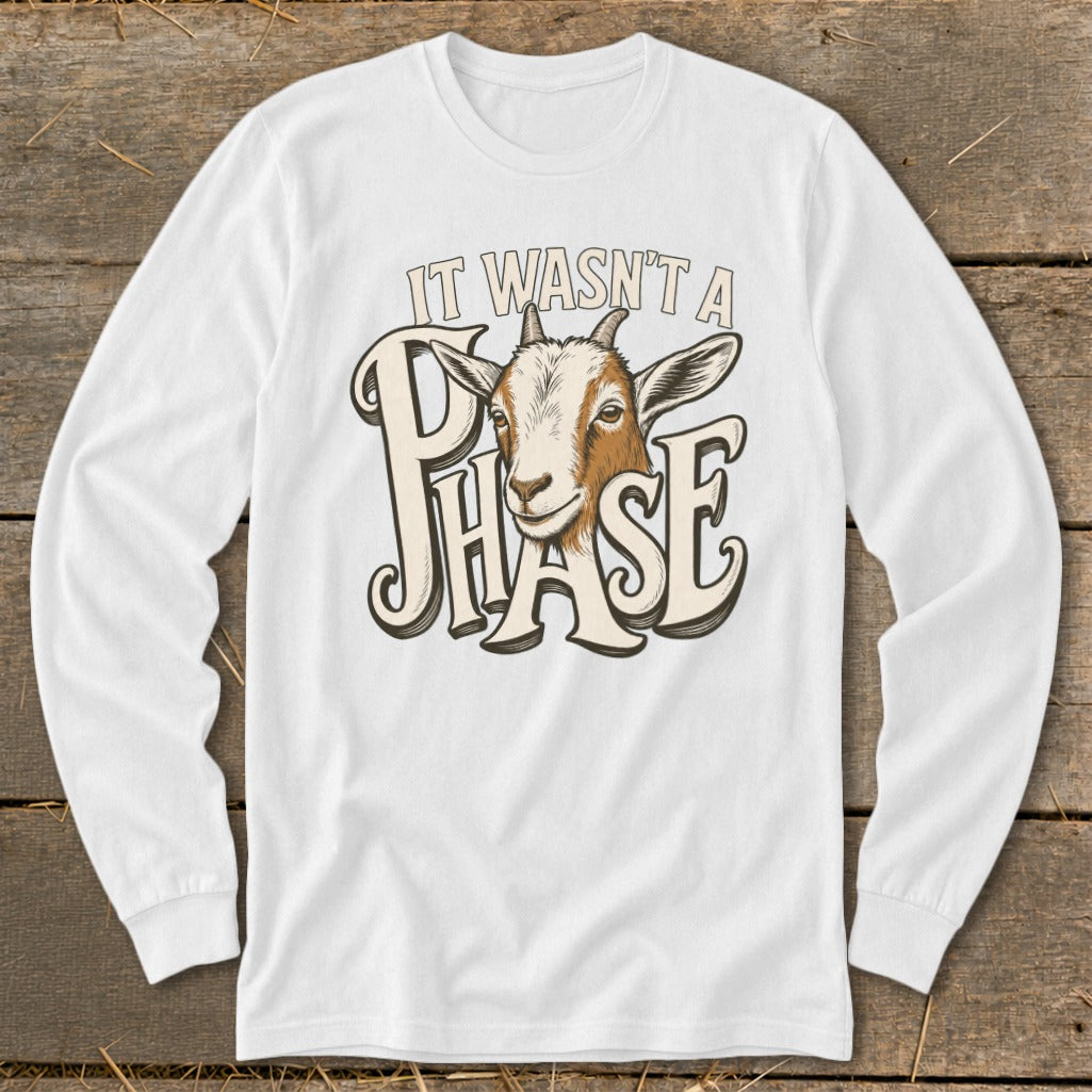 White long-sleeve shirt with goat graphic and text "IT WASN'T A PHASE".