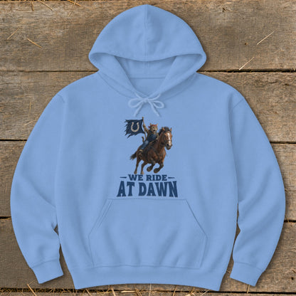 Light blue hoodie with graphic of cat riding horse and flag, text "WE RIDE AT DAWN".