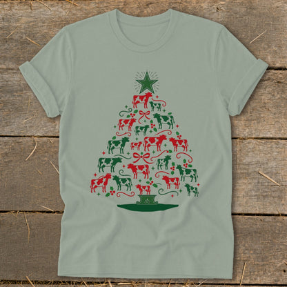 T-shirt with Christmas tree shape made of red and green cows and festive accents.