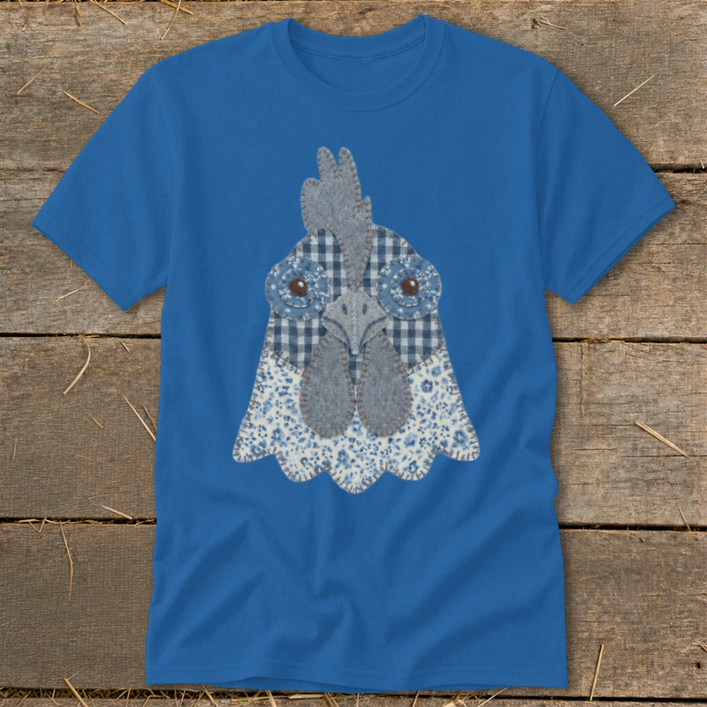 Blue t-shirt with a textured chicken head applique made of fabric.