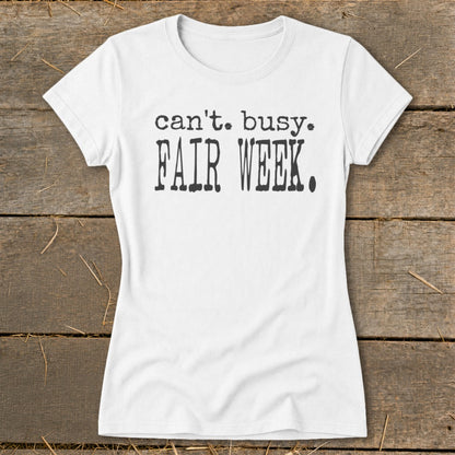 White t-shirt with black text that reads "can't. busy. FAIR WEEK."