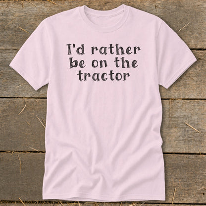 Pink t-shirt with black text "I'd rather be on the tractor".
