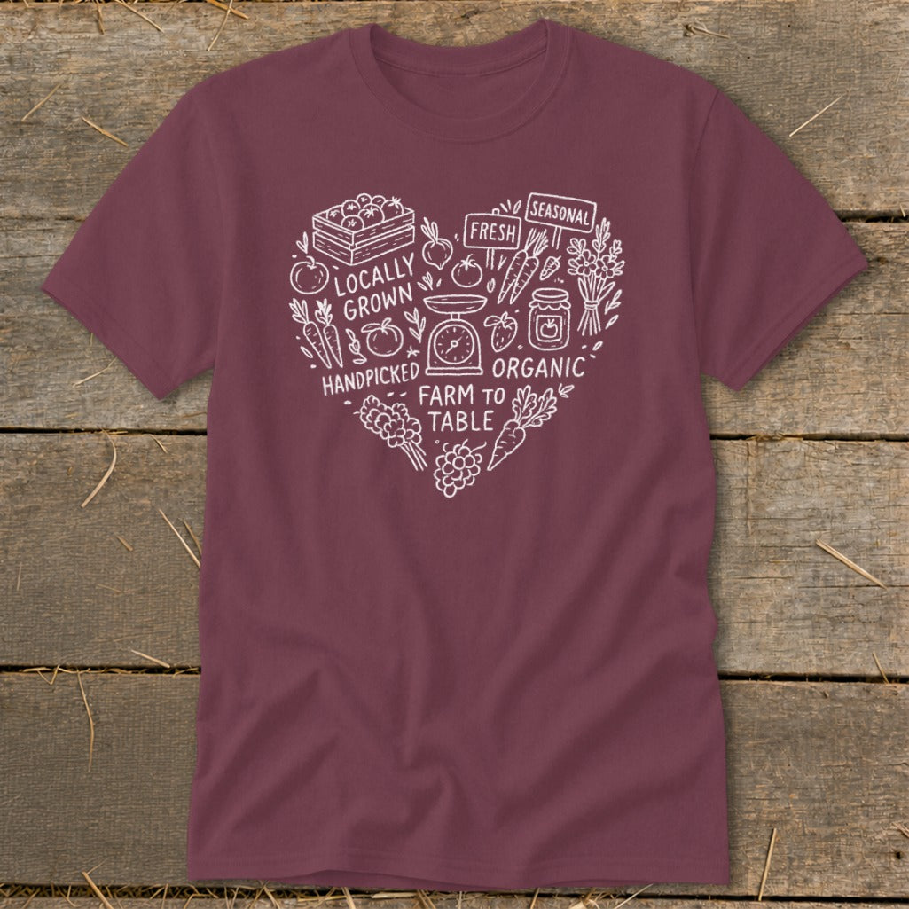 Maroon t-shirt with a white heart graphic featuring farm produce and text.
