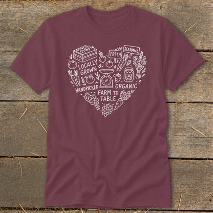 Maroon t-shirt with a white heart graphic featuring farm produce and text.