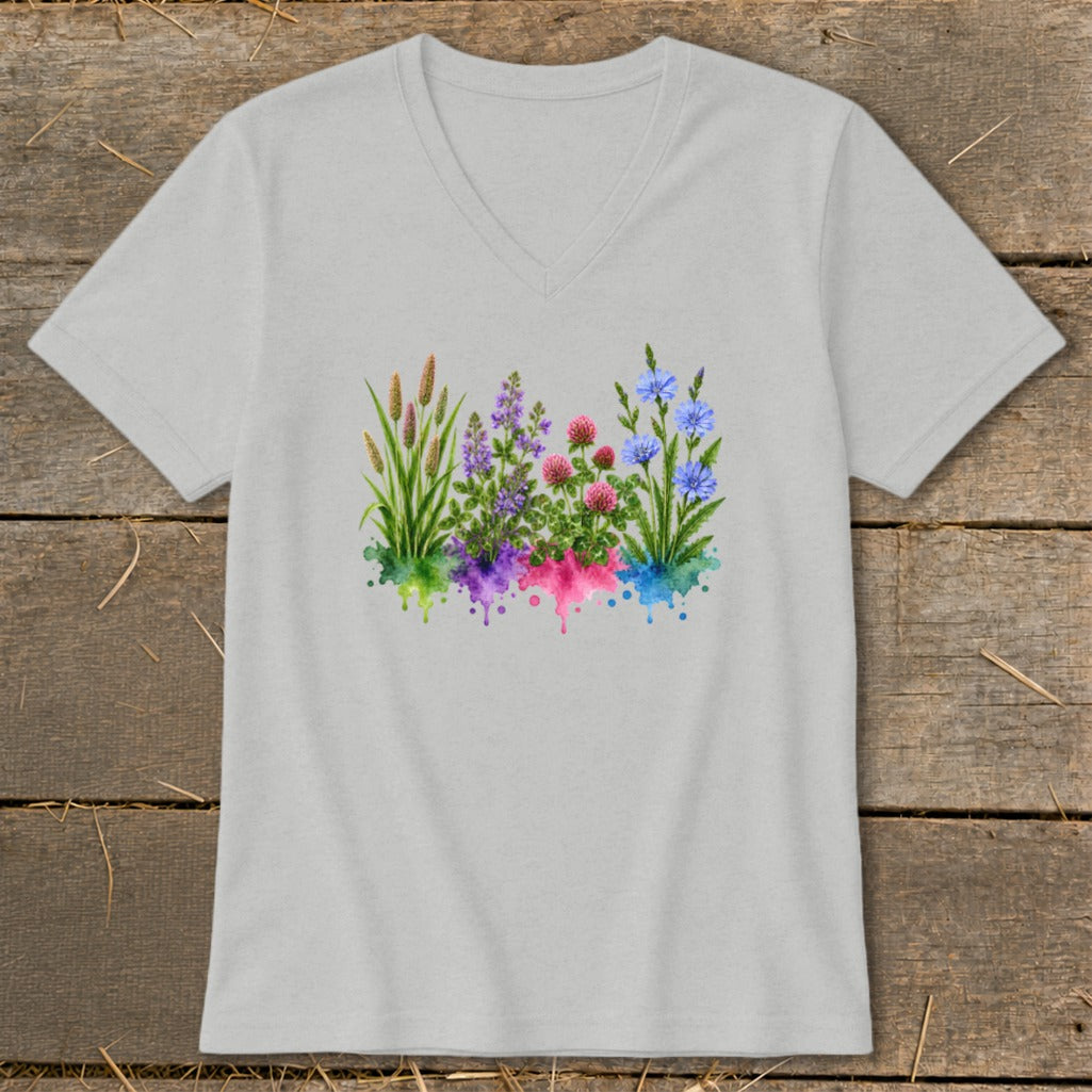 A light gray V-neck t-shirt featuring a watercolor graphic of colorful wildflowers and grasses centered on the chest.