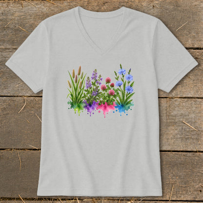A light gray V-neck t-shirt featuring a watercolor graphic of colorful wildflowers and grasses centered on the chest.