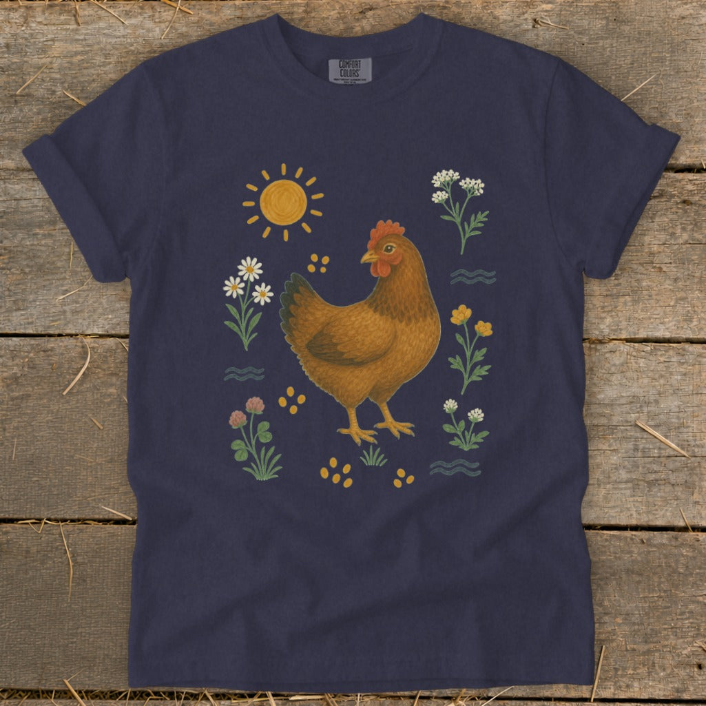Navy t-shirt with illustration of a brown hen surrounded by flowers and sun.
