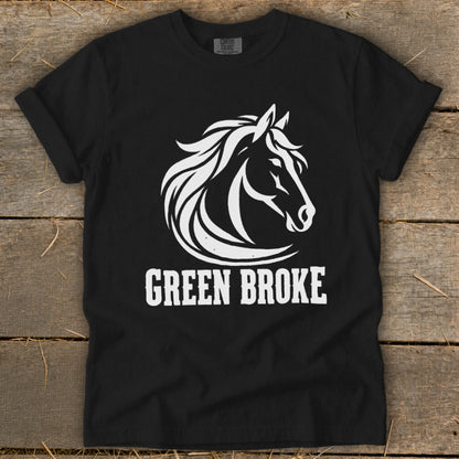 A black t-shirt featuring a white graphic of a horse's head and the text GREEN BROKE.