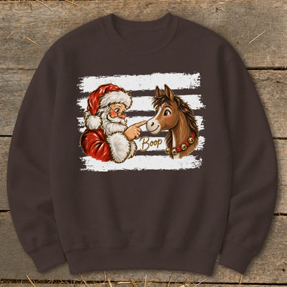 Santa boops a horse on the nose with the word "Boop" on a brown sweatshirt.