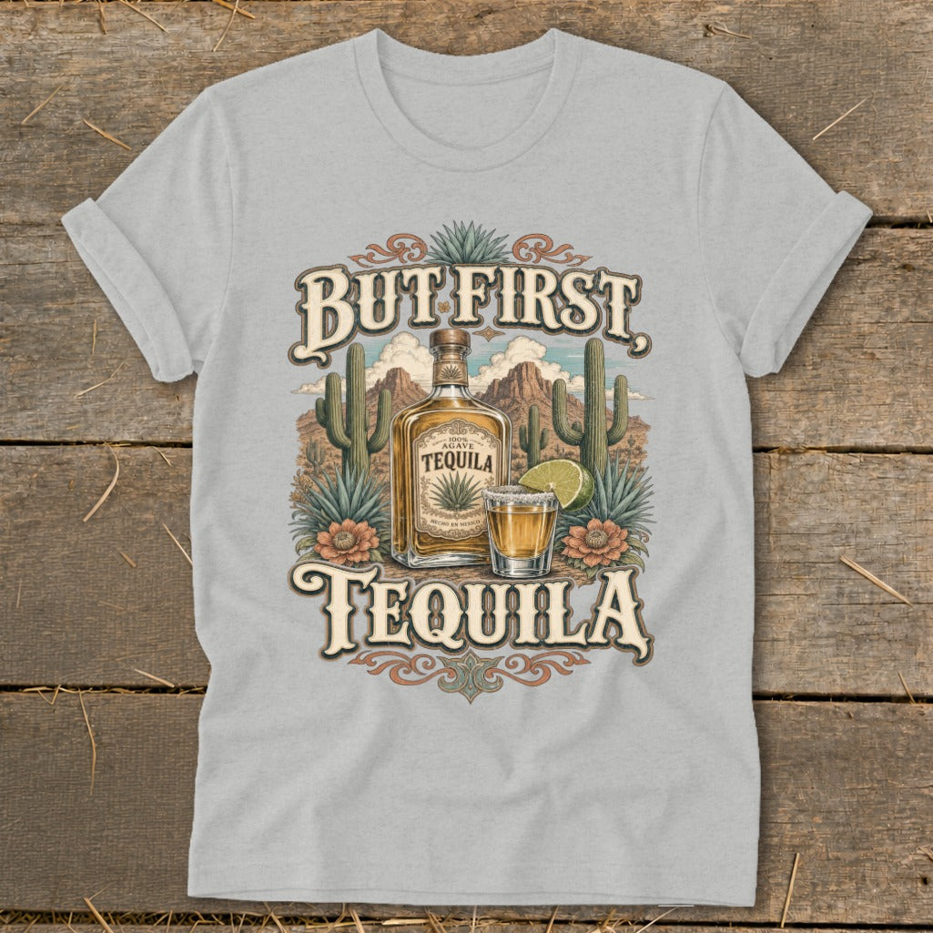 Grey t-shirt with "But First, Tequila" graphic featuring a tequila bottle and shot glass.