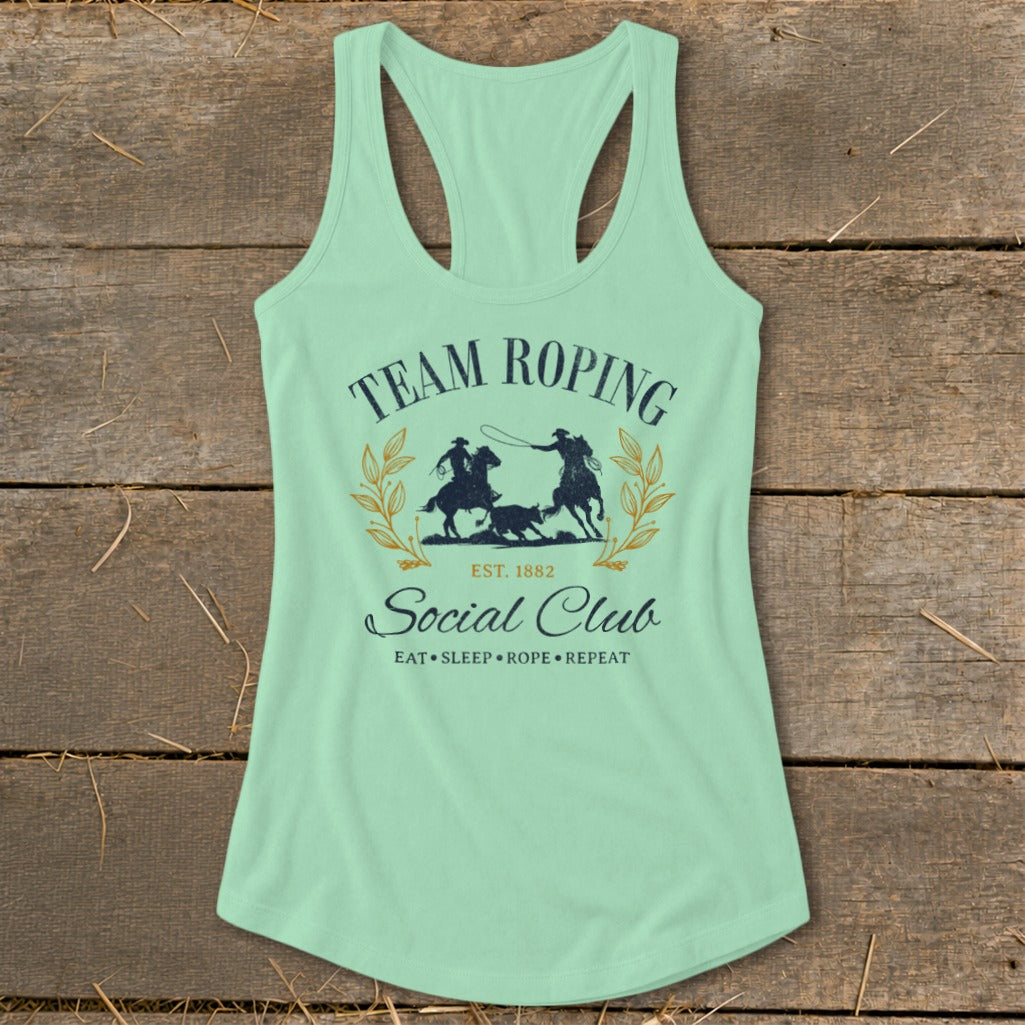 Mint green tank top with "Team Roping Social Club" graphic and rodeo scene.