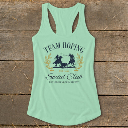 Mint green tank top with "Team Roping Social Club" graphic and rodeo scene.