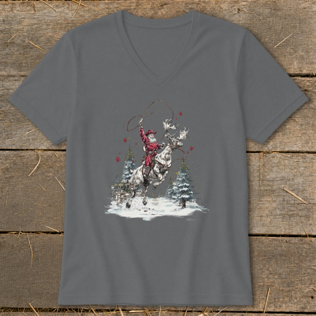 Santa Claus rides a reindeer with a lasso in a snowy winter forest scene.