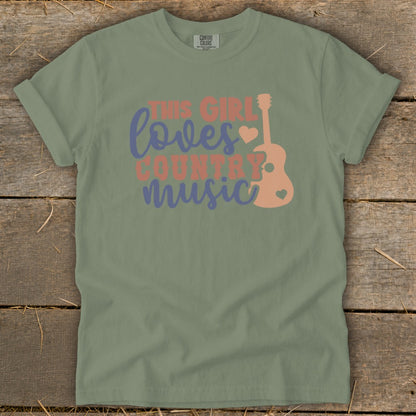 Green t-shirt with "This Girl Loves Country Music" text and guitar graphic.
