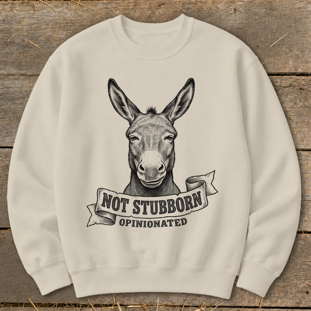 Cream sweatshirt with donkey illustration and text "NOT STUBBORN, OPINIONATED"