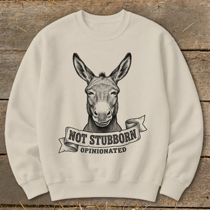 Cream sweatshirt with donkey illustration and text "NOT STUBBORN, OPINIONATED"
