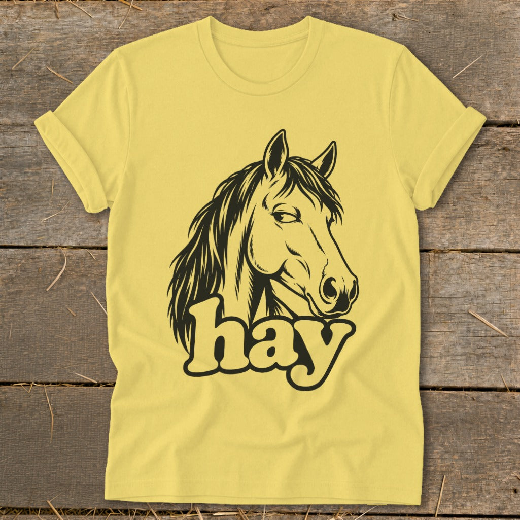 Yellow t-shirt with a black horse head graphic and the word "hay".