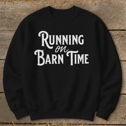 Black crewneck sweatshirt with white text "Running on Barn Time".