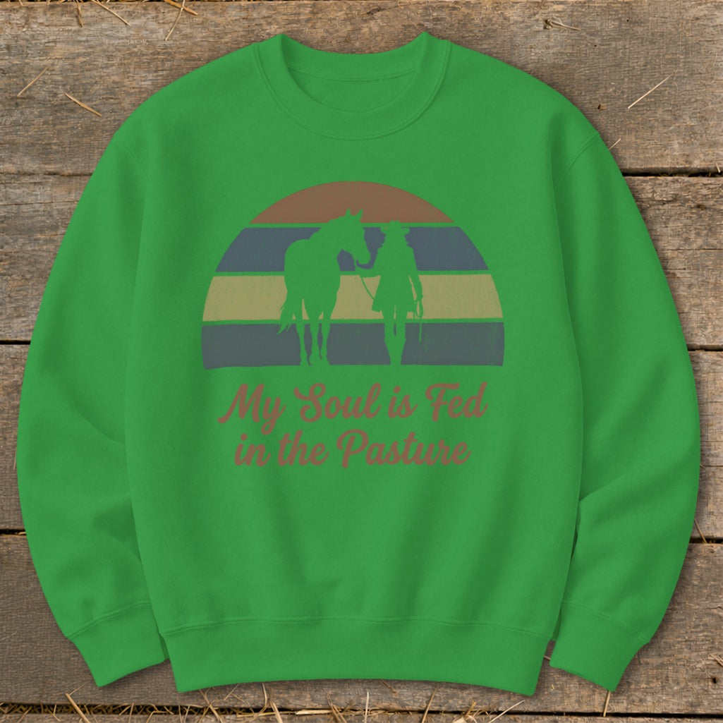 Green sweatshirt with horse and rider silhouette and text "My Soul is Fed in the Pasture."