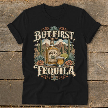 Black t-shirt with "But First Tequila" text, bottle, shot, and desert scene graphic.