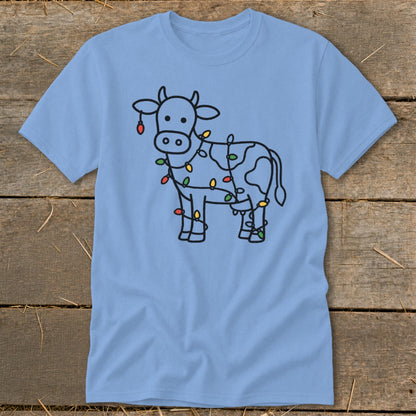 Light blue t-shirt with a black line drawing of a cow wrapped in Christmas lights.